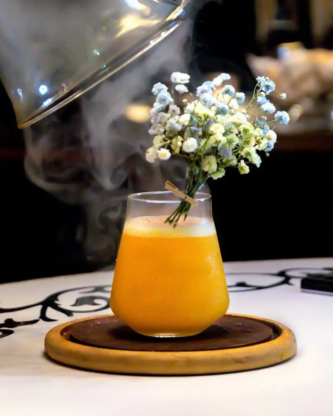 Let the smoke linger and the floral notes enchant. This cocktail at Bombay Velvet is a visual and sensory experience you won’t forget.